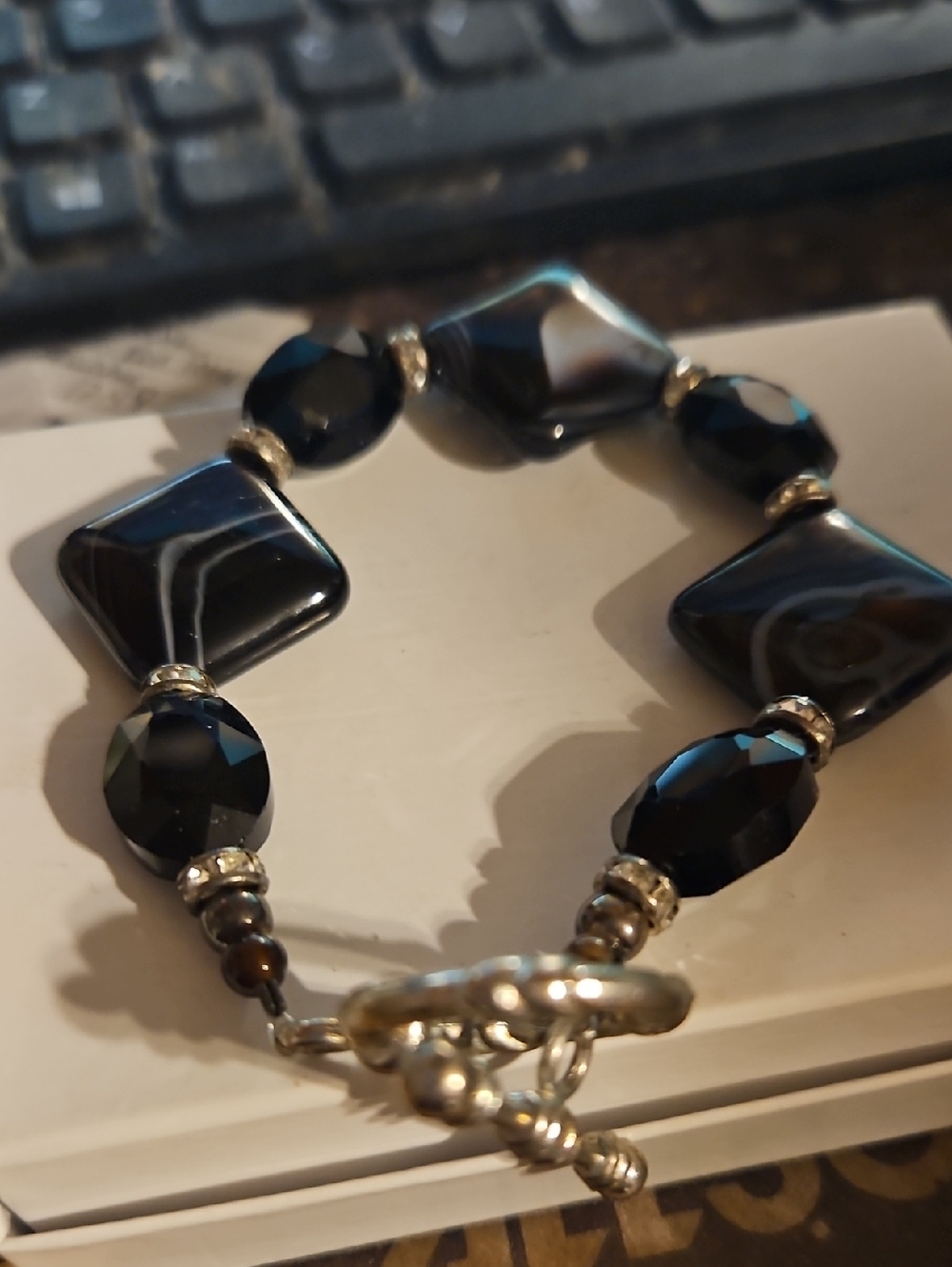 Silvertone Black Swirled Triangle Toggle Clasp Bracelet